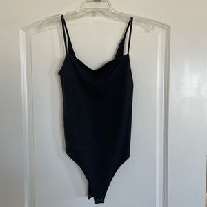 Black tank top bodysuit, never worn. Size medium